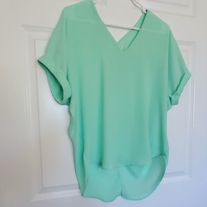 Mint Blouse with cuffed sleeves.